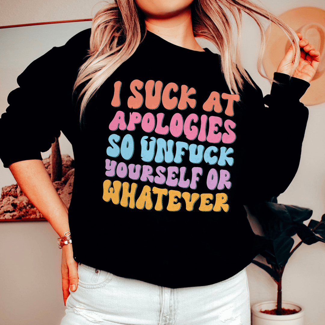 A cozy 'I Suck At Apologies' sweatshirt featuring a unique design by top artists, made from a soft cotton/poly fleece blend.