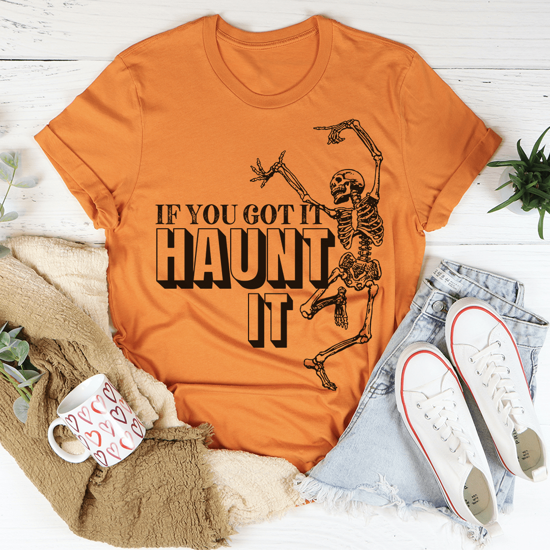 If You Got It Haunt It T-Shirt featuring spooky design, made from soft ring-spun cotton, perfect for Halloween and casual wear.