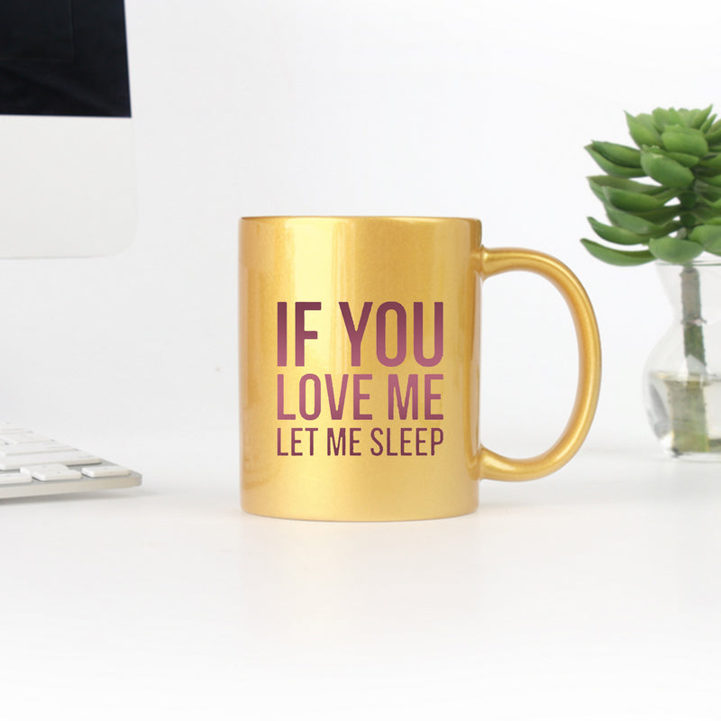 Elegant gold and silver ceramic mug with the phrase 'If You Love Me Let Me Sleep' designed for stylish beverage enjoyment.