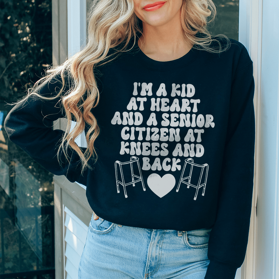 Cozy 'I'm A Kid At Heart And A Senior Sitizen' sweats featuring a unique design, perfect for casual wear.