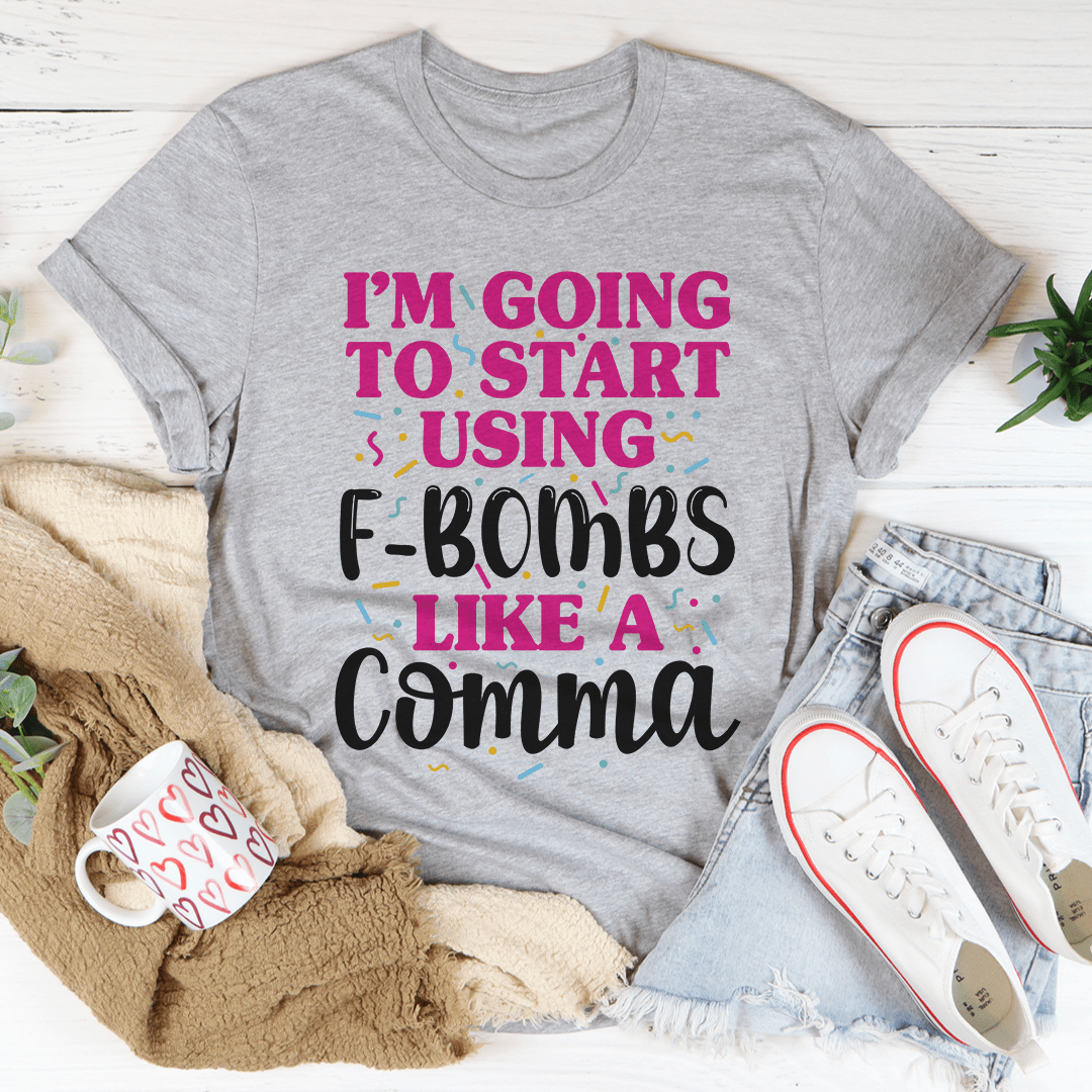 A stylish F-Bombs Like A Comma Tee made from soft ring-spun cotton, featuring double stitching for durability.