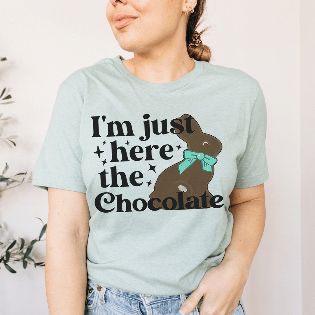 A comfortable and stylish t-shirt featuring the phrase 'I'm Just Here For The Chocolate' printed on it, made from soft ring-spun cotton.