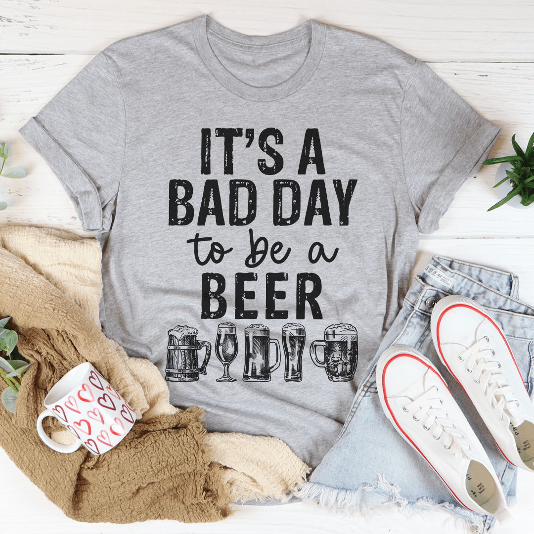 It's A Bad Day To Be A Beer T-Shirt featuring humorous text on a soft cotton fabric, perfect for casual wear.