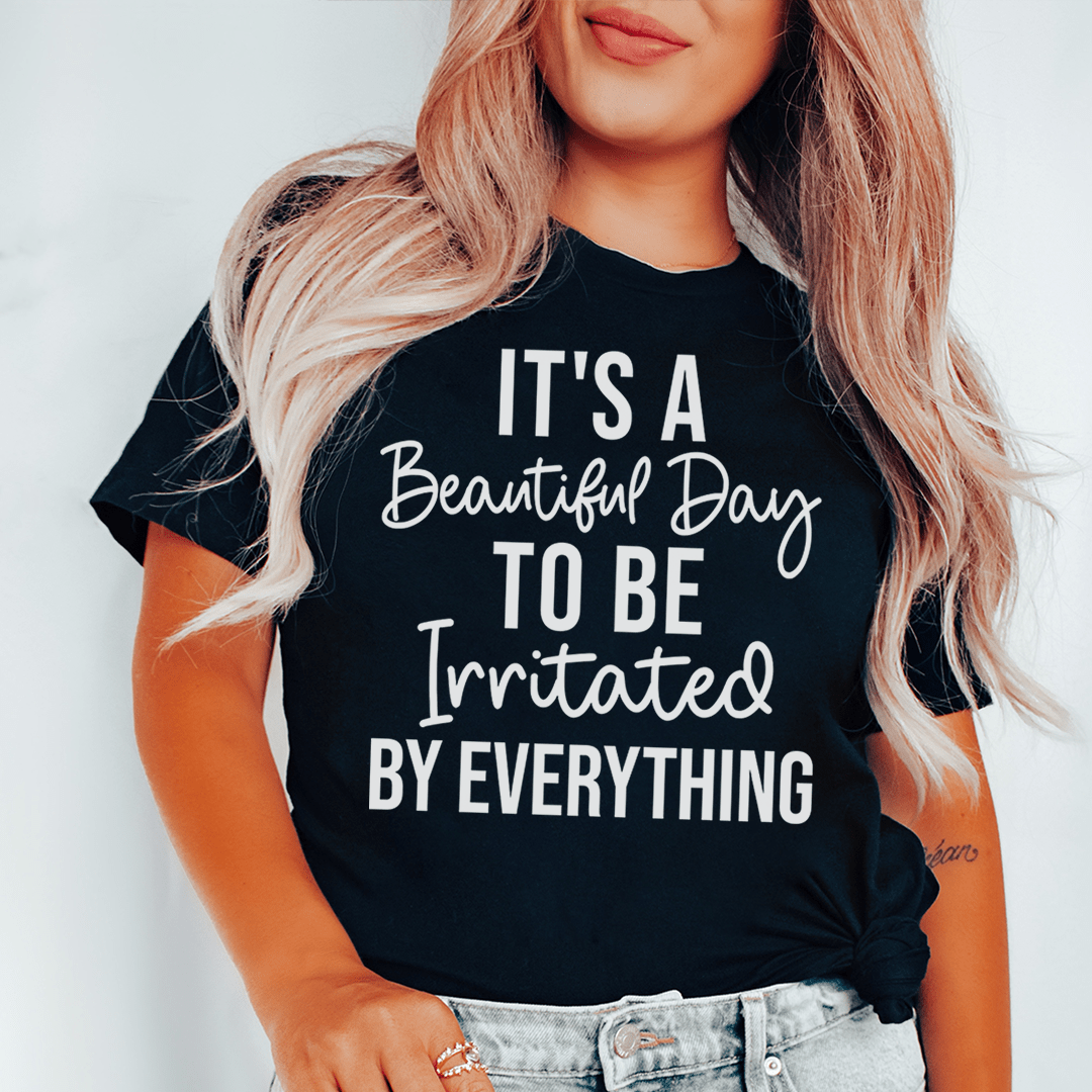 A stylish t-shirt featuring the phrase 'It's A Beautiful Day To Be Irritated By Everything', made from soft cotton with double stitching.