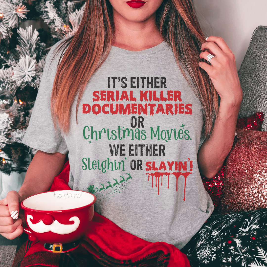 A humorous t-shirt featuring the phrase 'It's Either Serial Killer Documentaries or Christmas Movies' printed on soft cotton fabric.