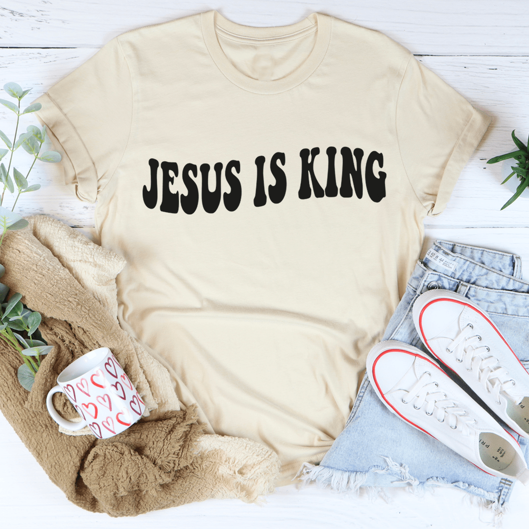 A stylish Jesus Is King Tee made from soft ring-spun cotton, featuring double stitching for durability and a comfortable fit.