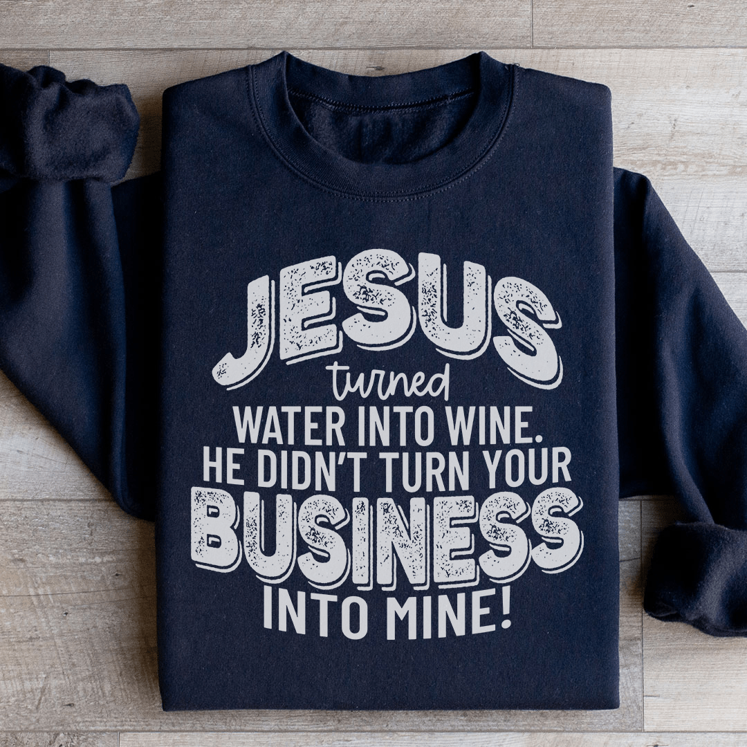 A cozy hoodie featuring the phrase 'Jesus Turned Water Into Wine', designed by top artists, showcasing a unique and stylish design.