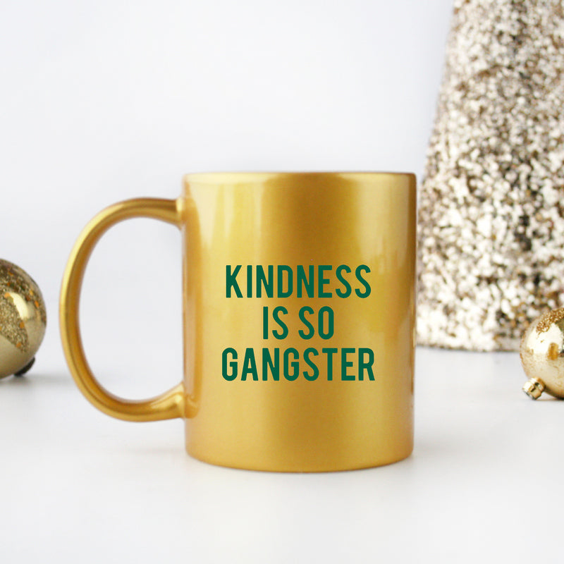 A stylish ceramic mug featuring a unique gangster-inspired design with gold metallic coating, perfect for coffee lovers.