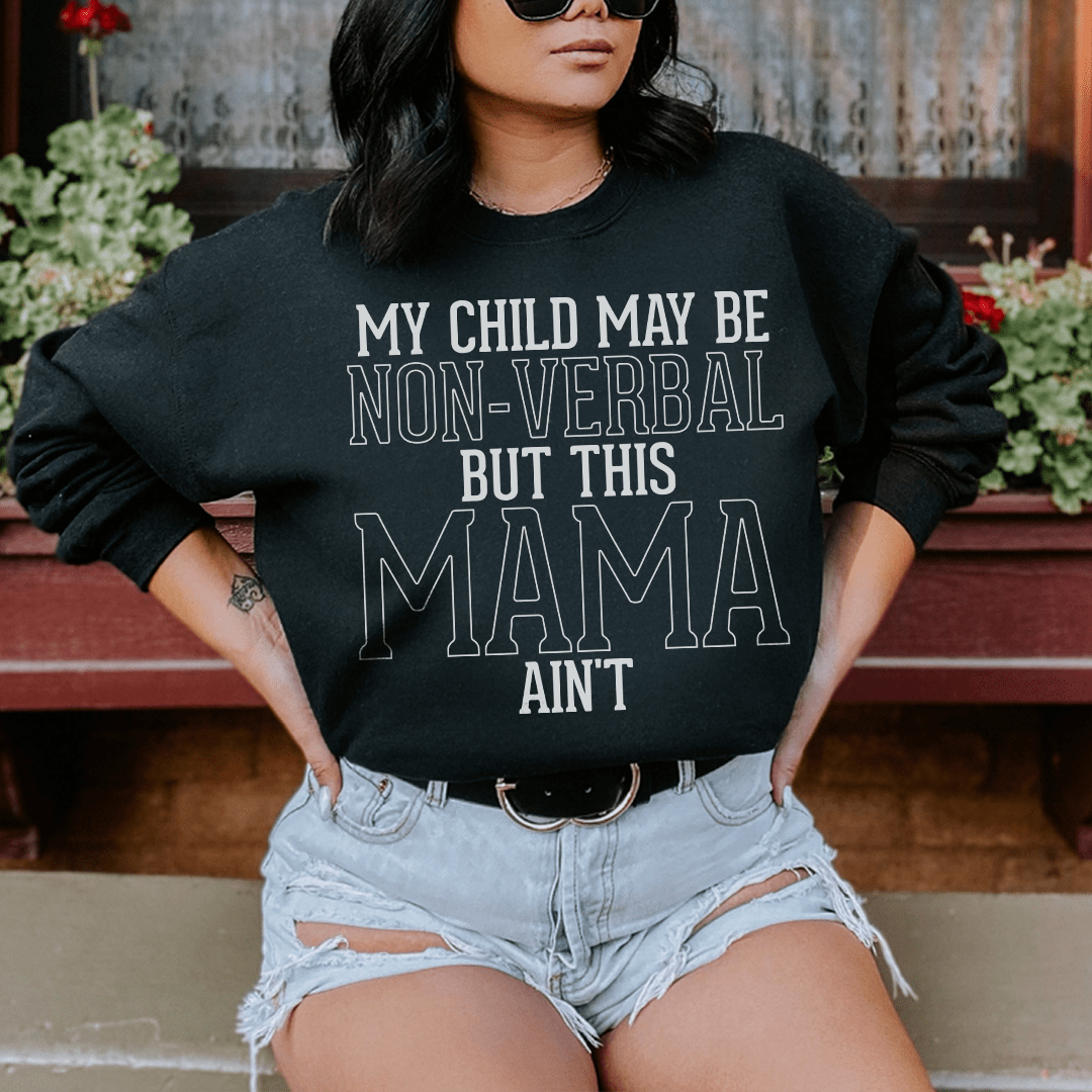 Cozy sweatshirt featuring the phrase 'My Child May Be Non Verbal But This Mama Ain't', designed for comfort and style.