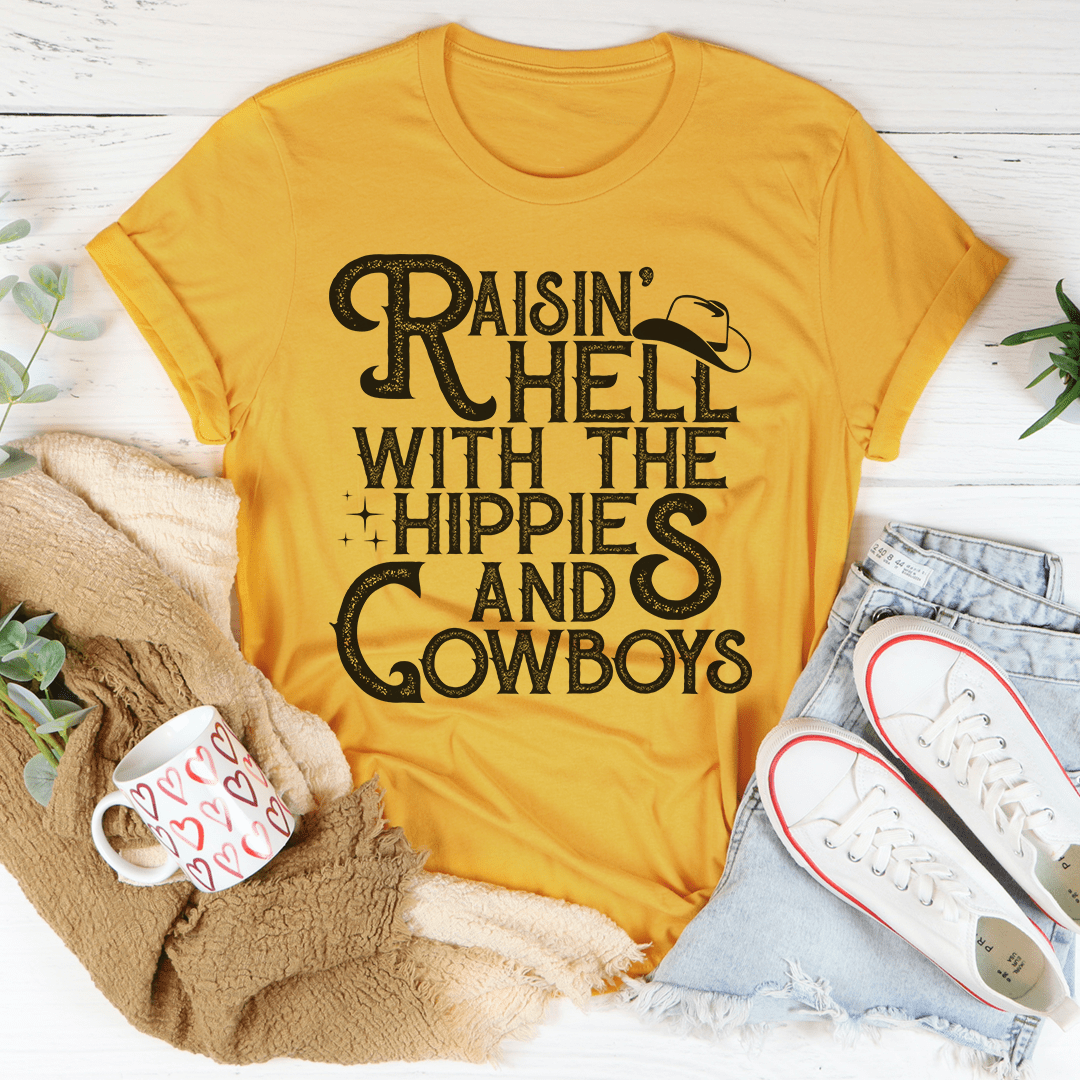 A stylish t-shirt featuring the phrase 'Raisin Hell With The Hippies And Cowboys', made from soft ring-spun cotton with double stitching.