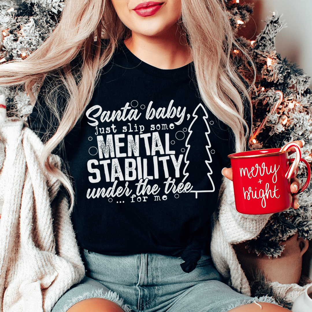 Santa Put Some Mental Stability Under The Tree For Me Tee, featuring a humorous design on a soft cotton fabric.