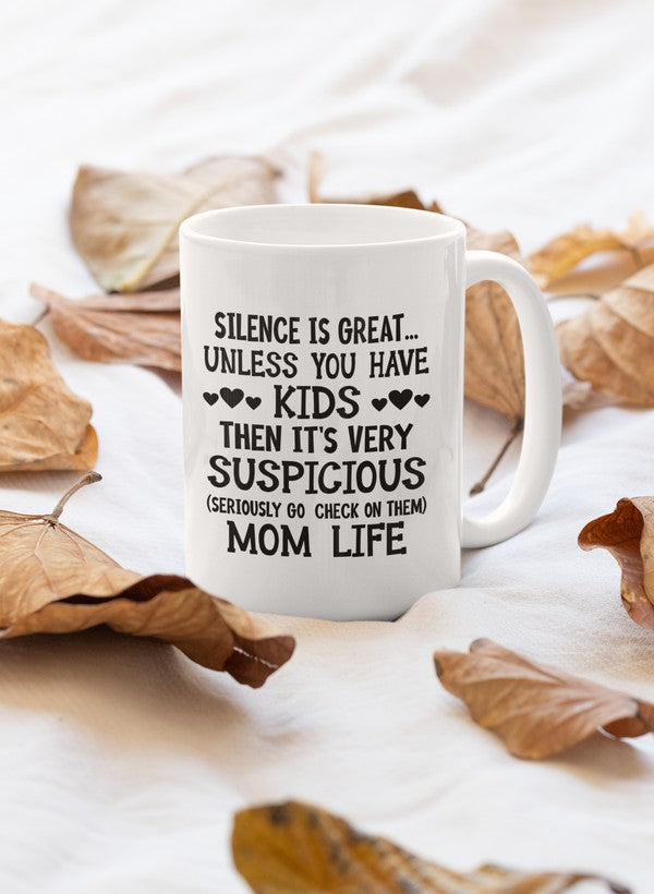 A humorous ceramic mug with the phrase 'Silence Is Great Unless You Have Kids', featuring a glossy finish and sturdy handle.