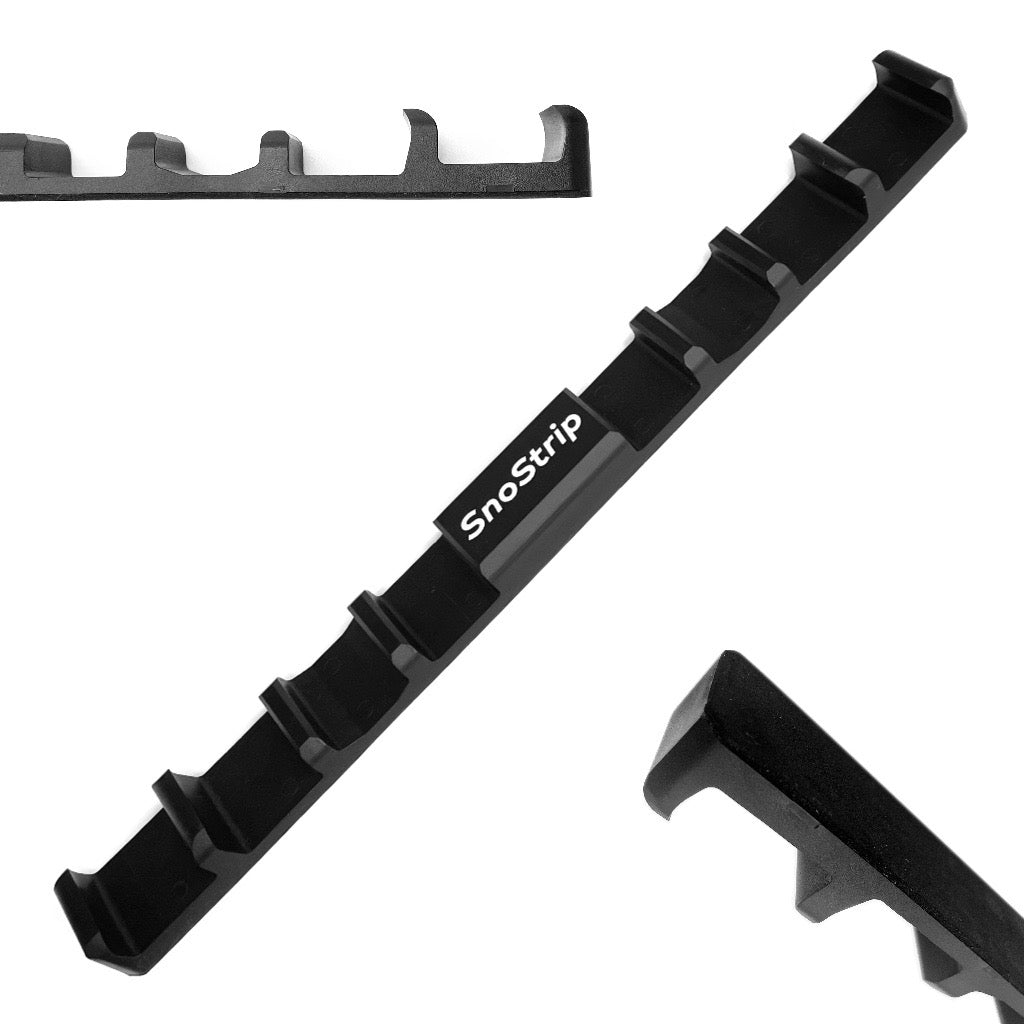 Magnetic SnoStrip™ securely holding skis against a car, showcasing its protective design and waterproof material.