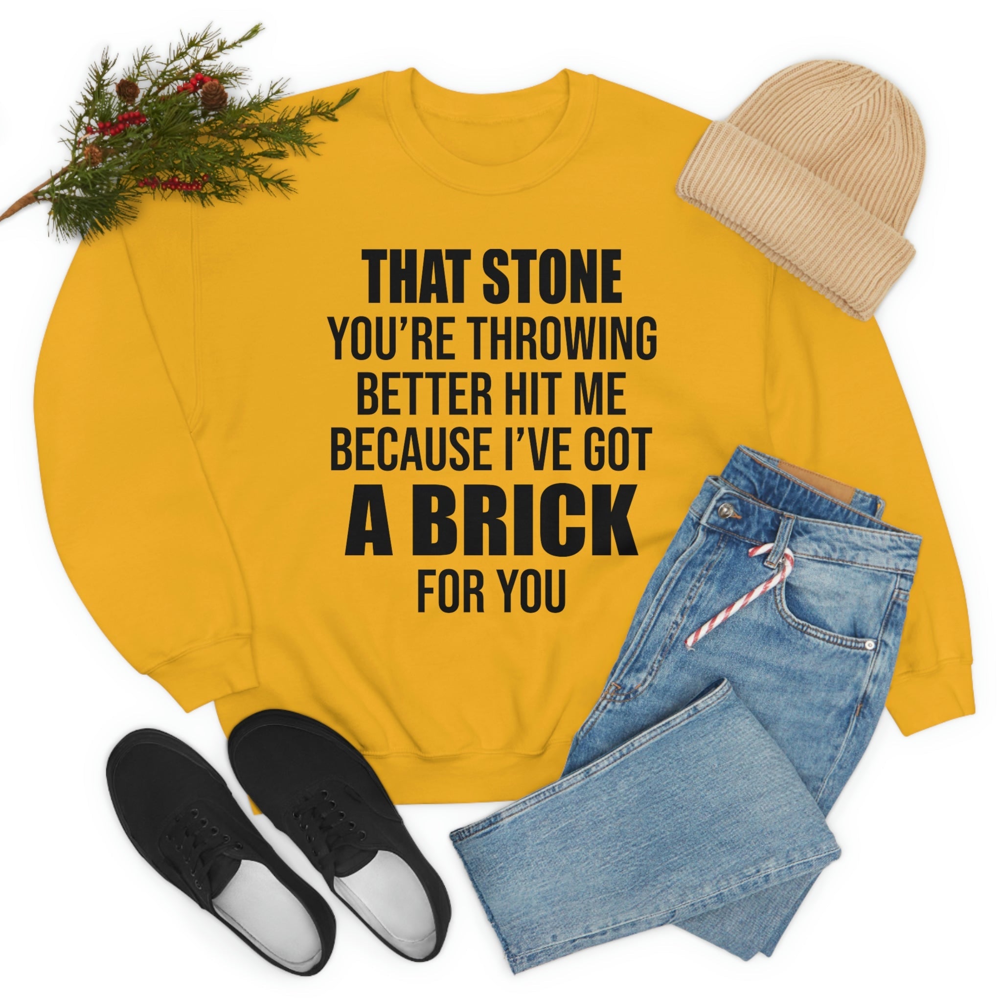 A stylish t-shirt featuring the phrase 'That Stone You’re Throwing Better Hit Me Because I’ve Got A Brick For', made from soft ring-spun cotton.