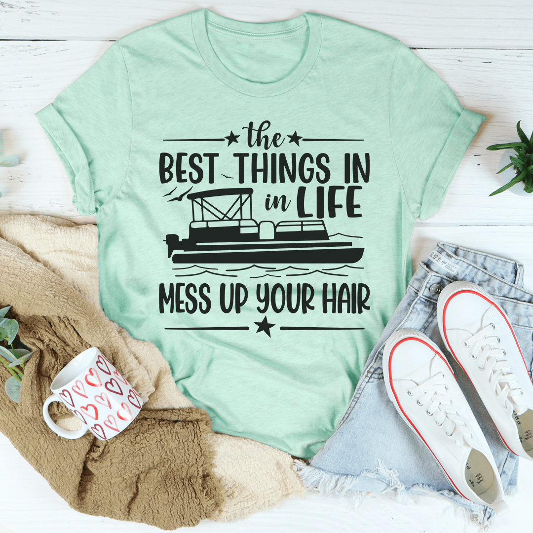 A comfortable and stylish t-shirt featuring the phrase 'The Best Things In Life Mess Up Your Hair', made from soft ring-spun cotton.