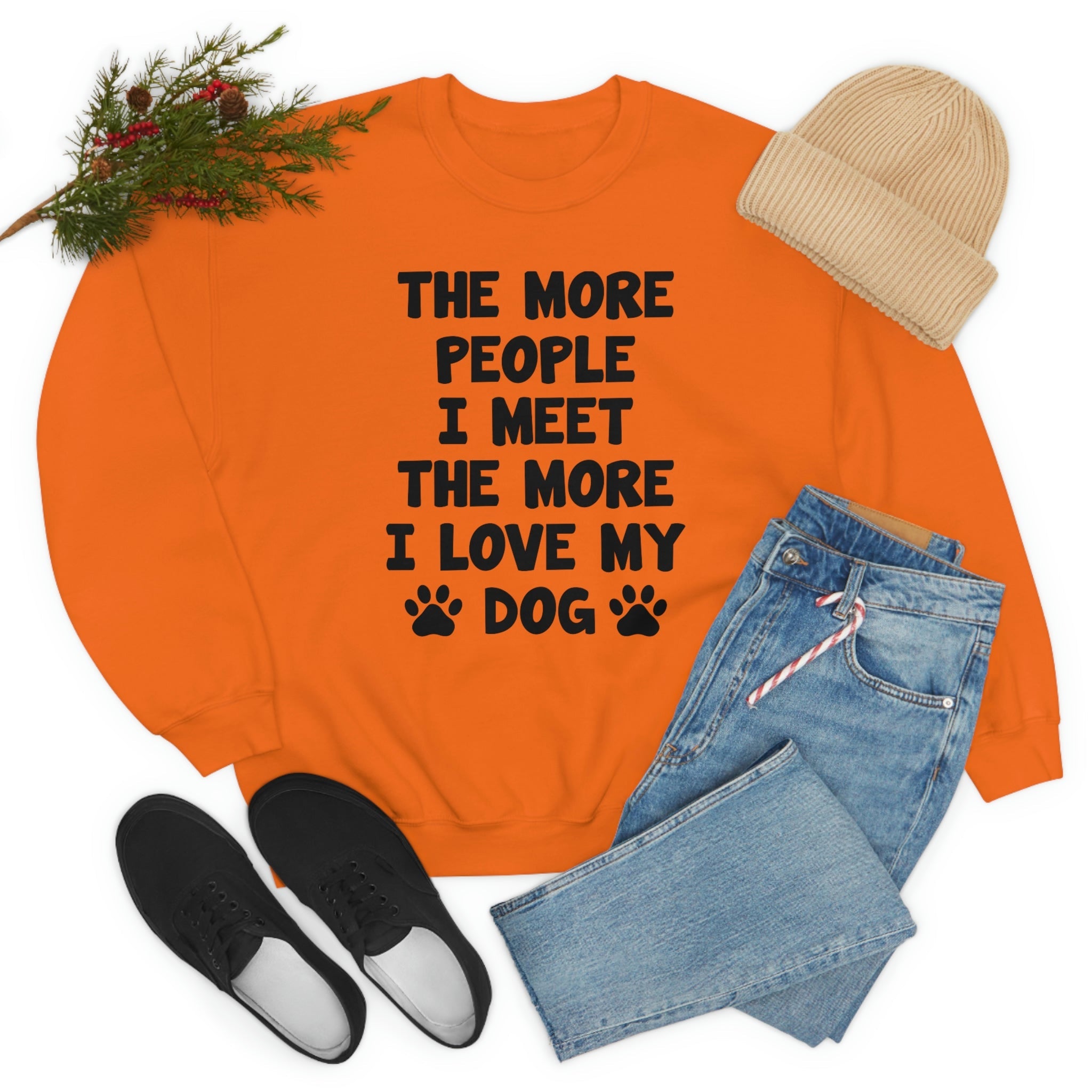 A stylish t-shirt featuring the phrase 'The More People I Meet The More I Love My Dog', made from soft ring-spun cotton.