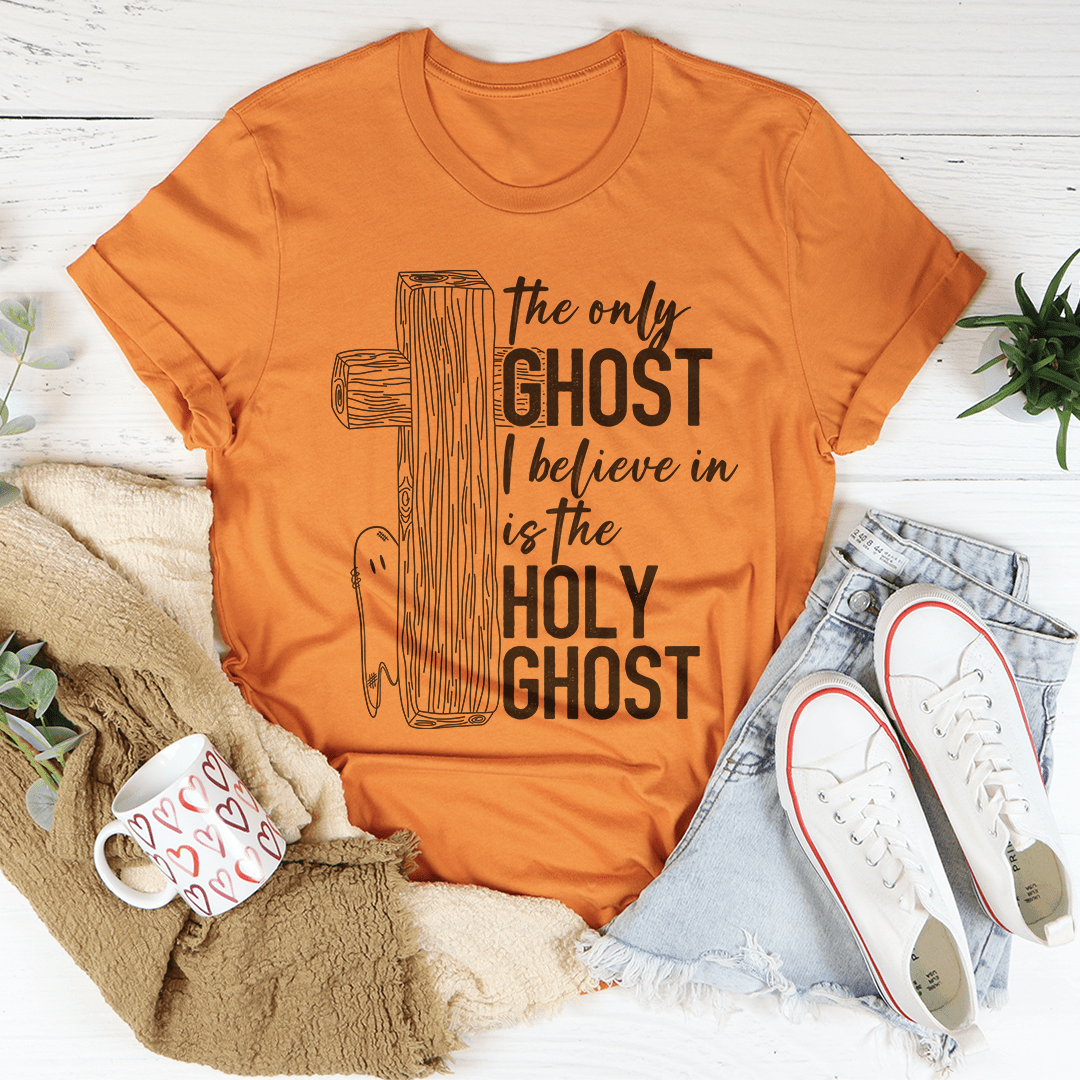 A stylish t-shirt featuring the phrase 'The Only Ghost I Believe In Is The Holy Ghost' printed on soft ring-spun cotton fabric.