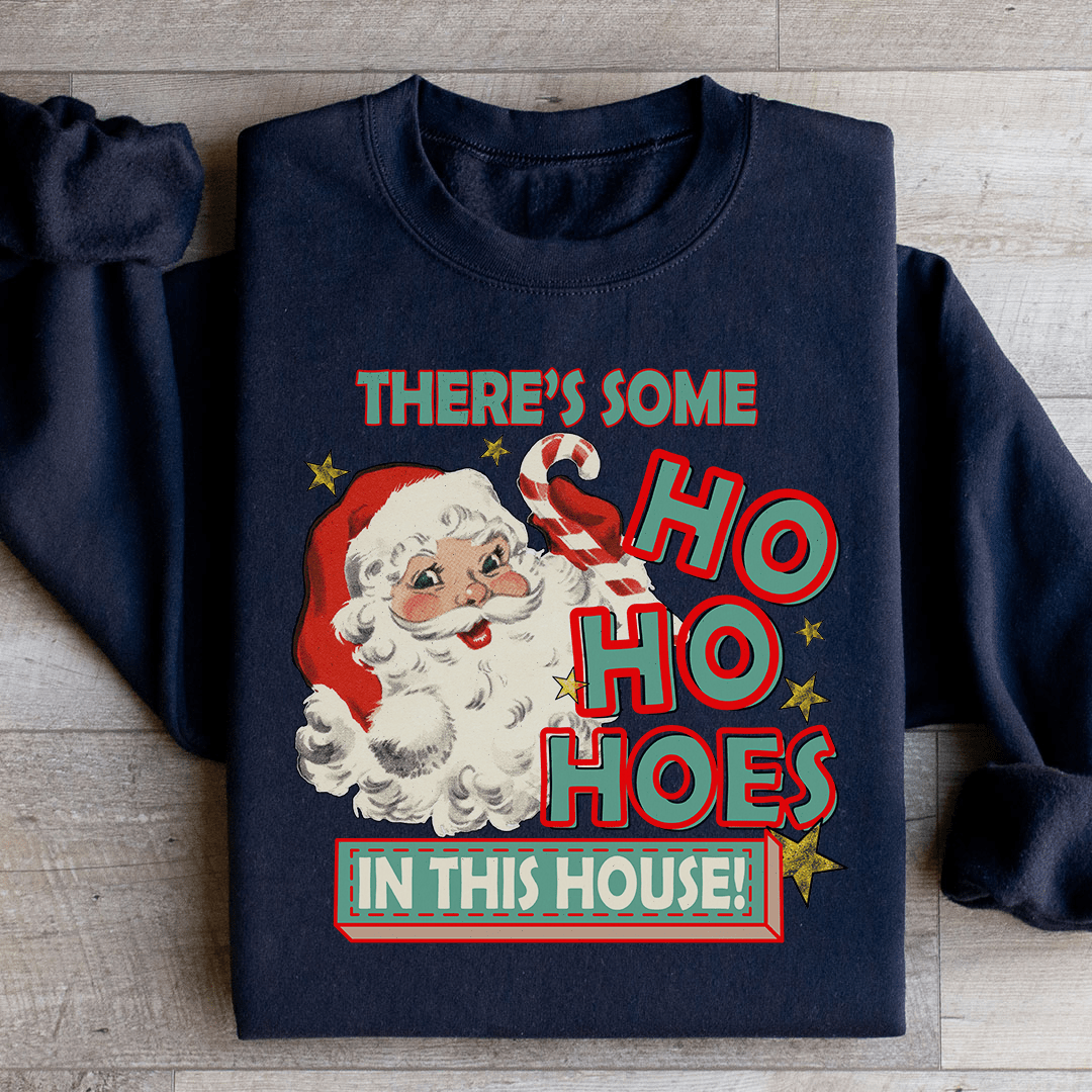 Cozy 'There's Some Ho Ho Hoes In This House' sweats featuring a unique design by top artists, made from a warm cotton/poly fleece blend.