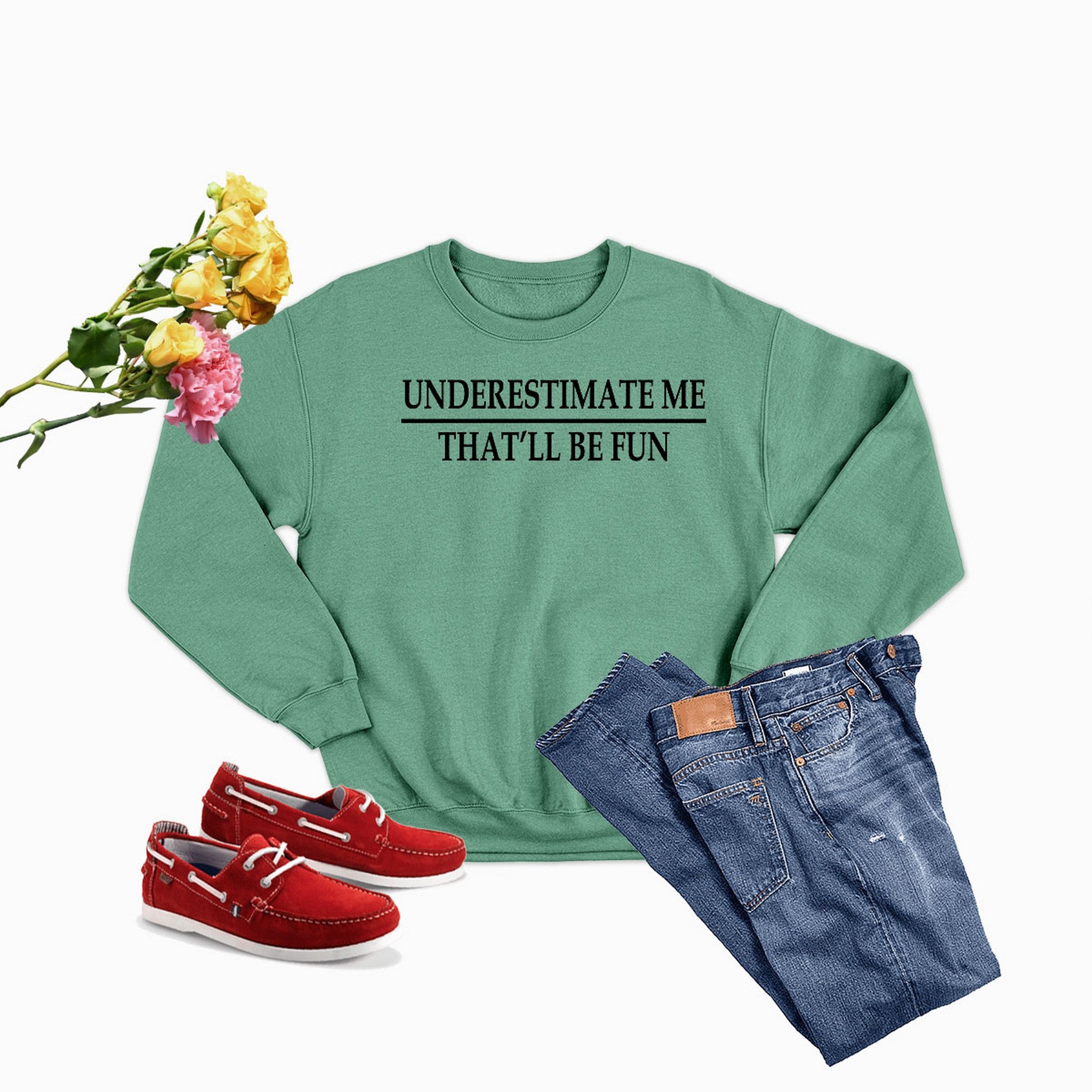 A cozy Underestimate Me Sweat Shirt made from soft ring-spun cotton, featuring double stitching for durability, available in various sizes.