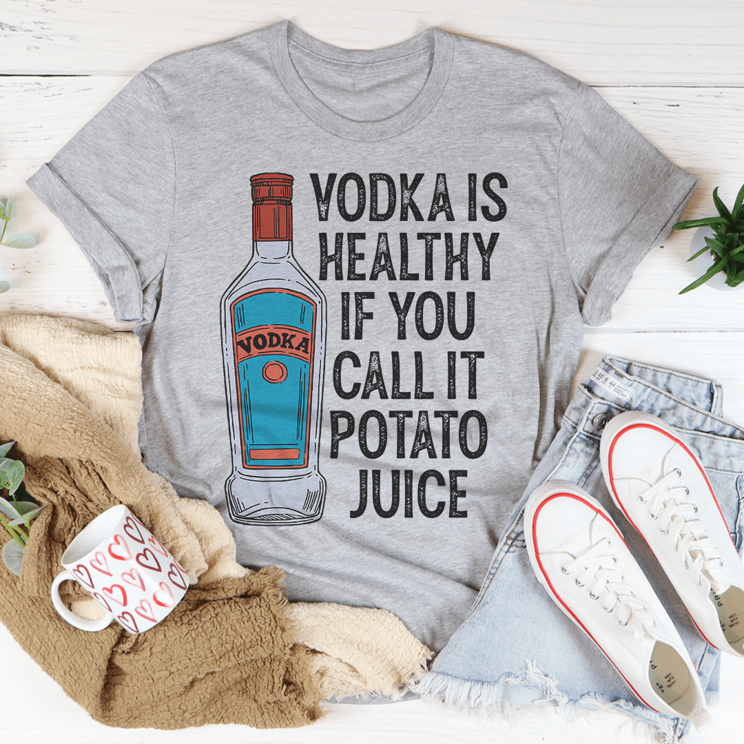 A humorous t-shirt featuring the slogan 'Vodka Is Healthy If You Call It Potato Juice', made from soft cotton with double stitching.