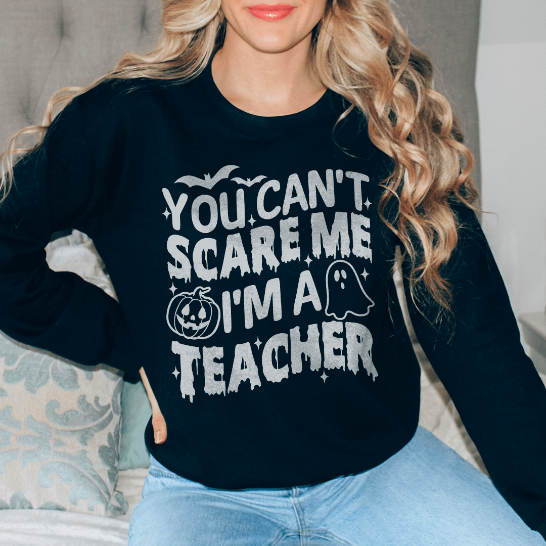 Cozy hoodie featuring the phrase 'You Can't Scare Me I'm A Teacher' designed for educators, made from soft cotton/poly fleece blend.