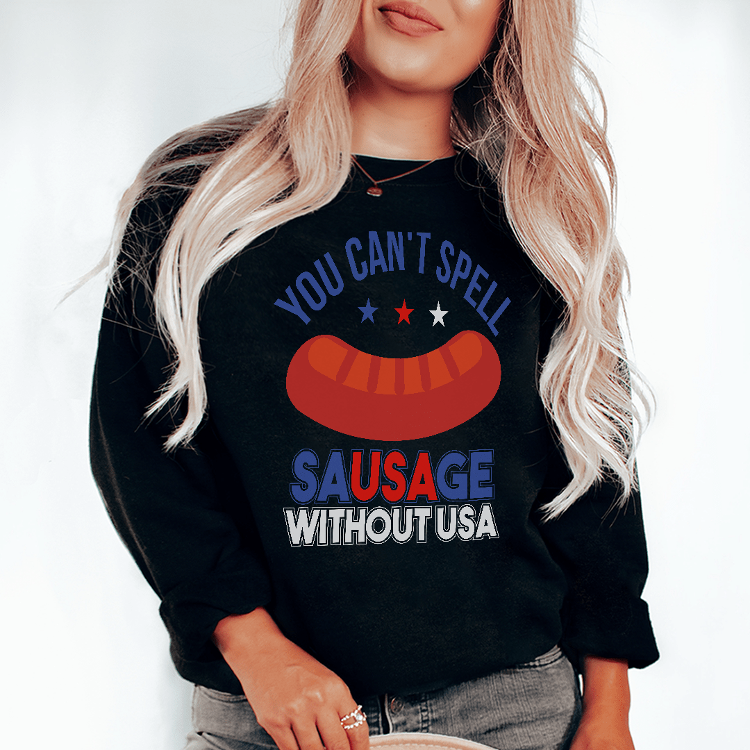 A cozy hoodie featuring the phrase 'You Can't Spell Sausage Without USA', designed by top artists, showcasing a unique and fun style.