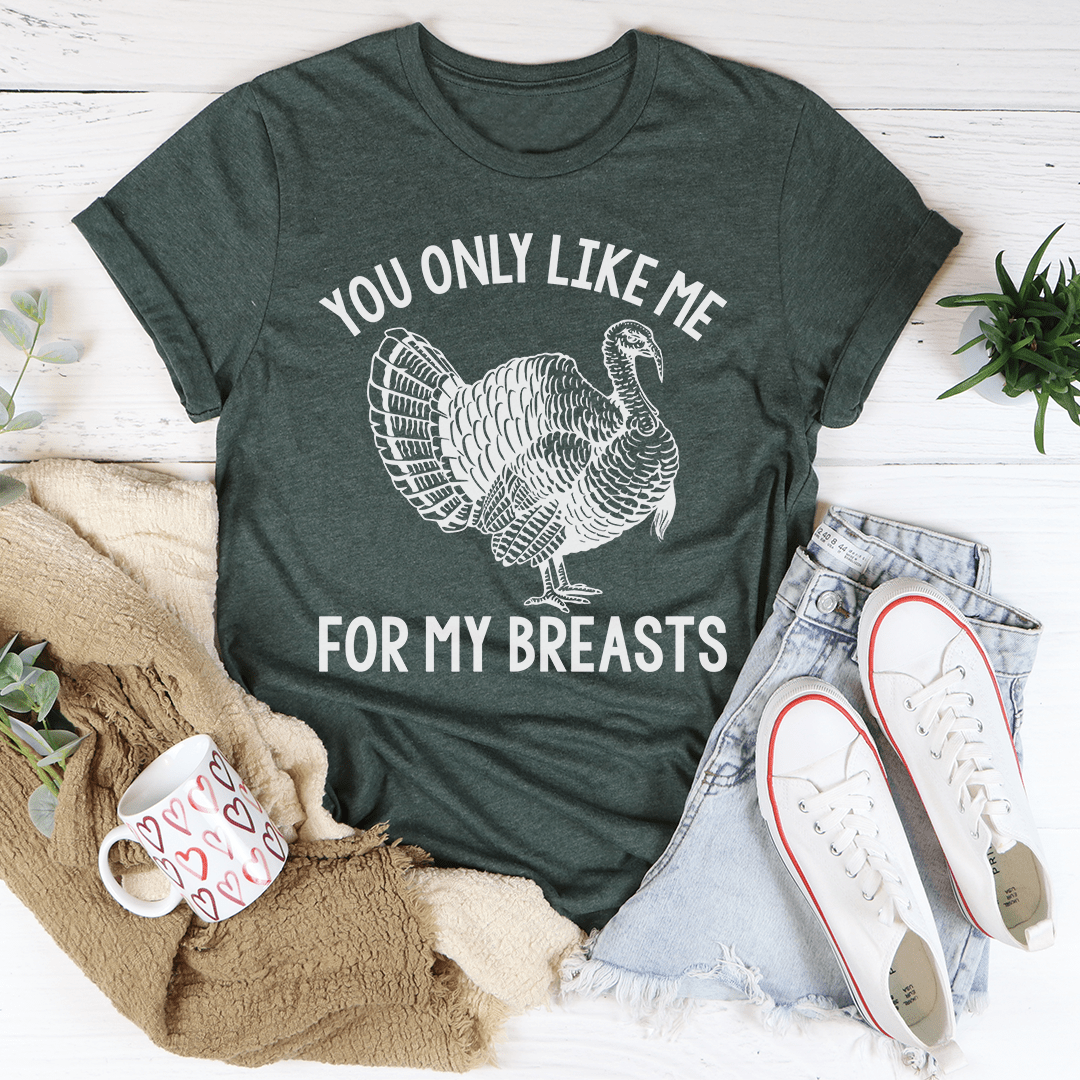 You Only Like Me For My Breasts Tee displayed on a mannequin, showcasing its soft cotton fabric and humorous slogan.