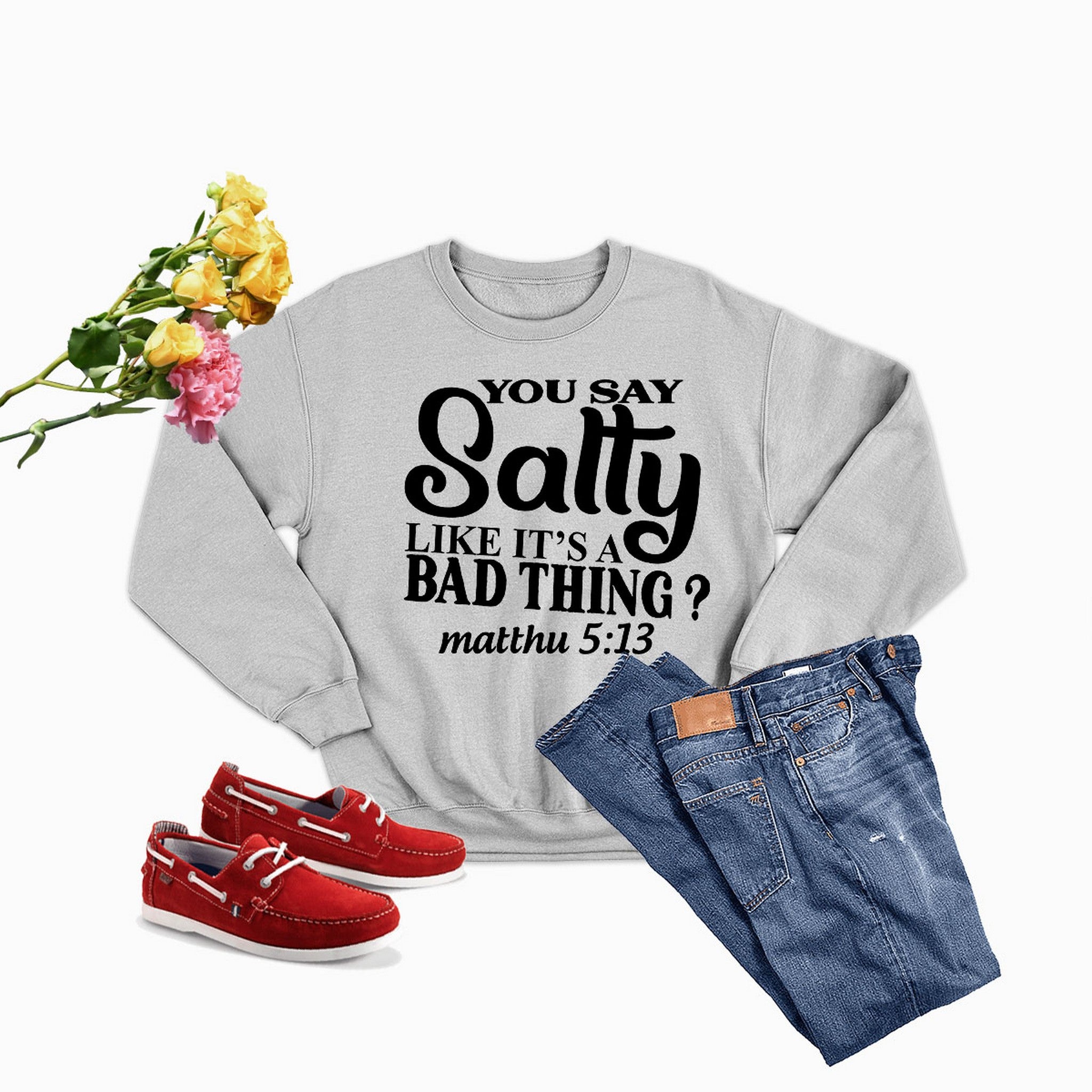 A cozy sweatshirt featuring the phrase 'You Say Salty Like It's A Bad Thing', made from soft cotton/poly fleece blend.