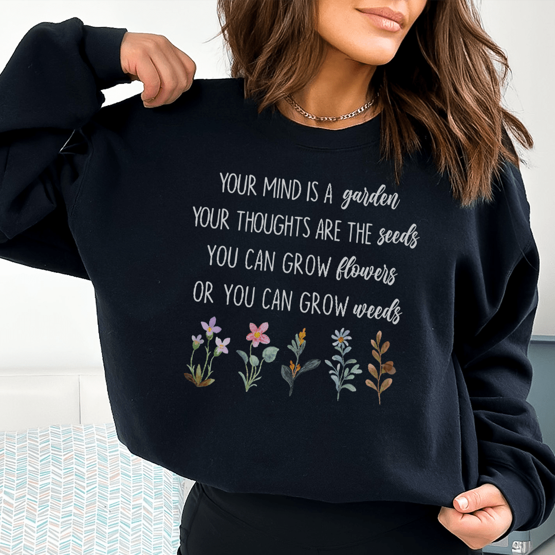 Cozy 'Your Mind Is A Garden' sweats featuring unique artistic designs, made from a warm cotton/poly fleece blend.
