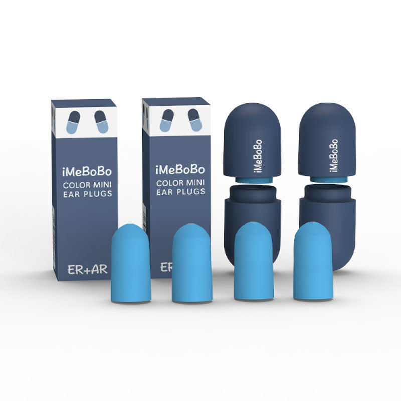 A pair of white silicone ear plugs designed for noise reduction, displayed in a compact storage box.