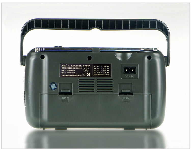 Portable AC and DC radio with built-in speaker, compact design, and power cord.