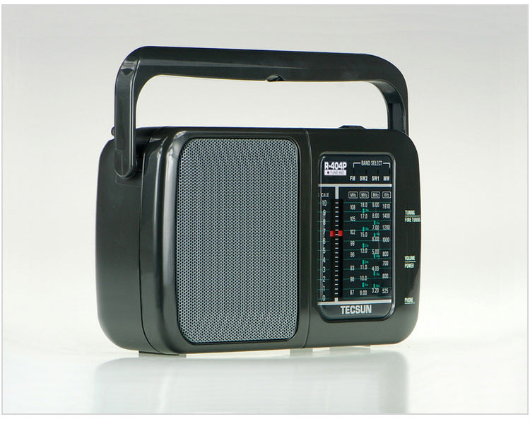 Portable AC and DC radio with built-in speaker, compact design, and power cord.