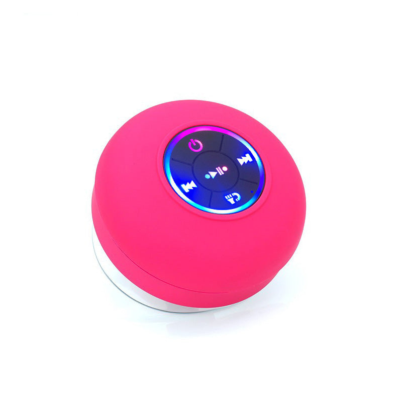 A waterproof Bluetooth speaker with LED lights, showcasing its sleek design and portable features, perfect for outdoor use.