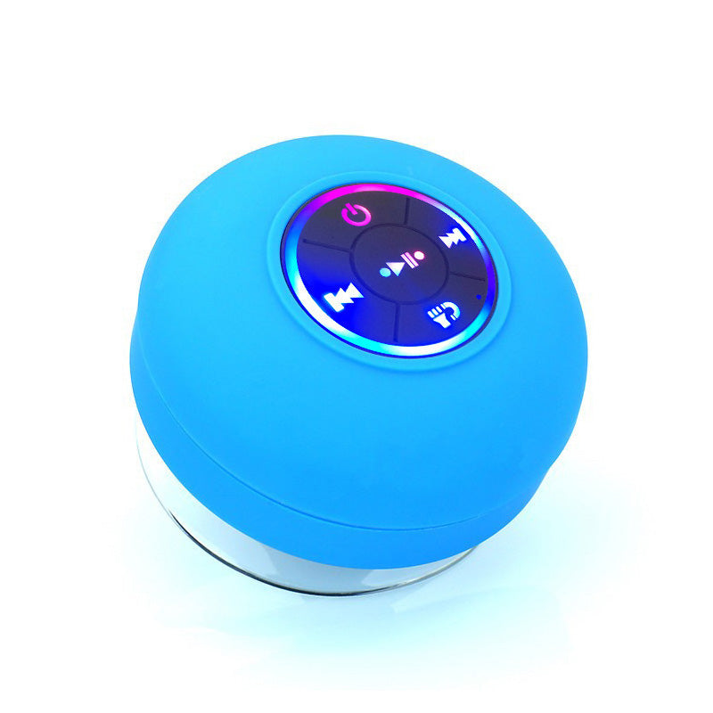 A waterproof Bluetooth speaker with LED lights, showcasing its sleek design and portable features, perfect for outdoor use.