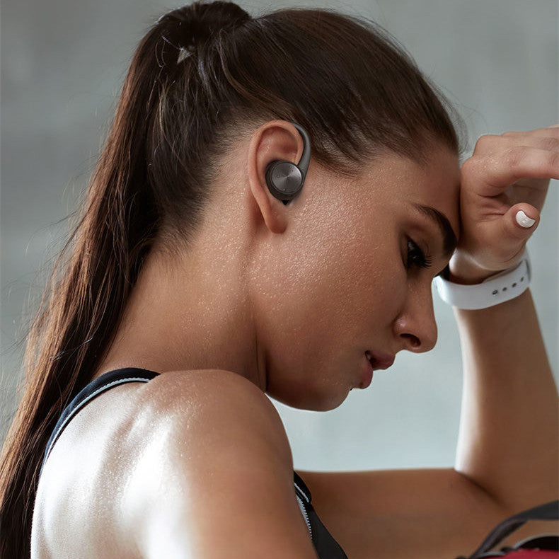 Wireless Bluetooth Headset in black and white colors, featuring a stylish hanging ear design for comfort and superior sound quality.