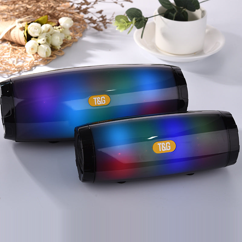 Wireless Bluetooth Speaker in various colors with LED lights, showcasing its portable design and features.