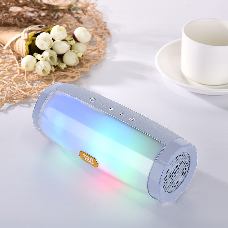 Wireless Bluetooth Speaker in various colors with LED lights, showcasing its portable design and features.