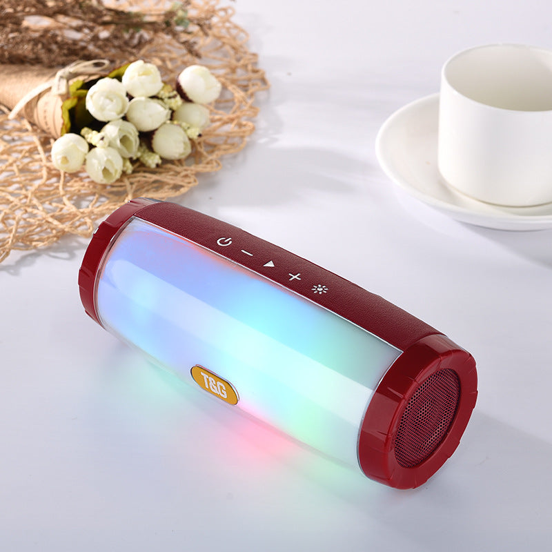 Wireless Bluetooth Speaker in various colors with LED lights, showcasing its portable design and features.