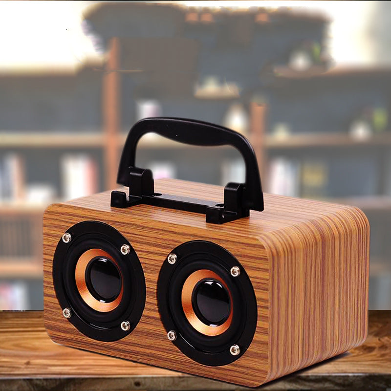 Wooden Wireless Bluetooth Speaker designed for outdoor use, featuring a stylish wooden shell and compact design.