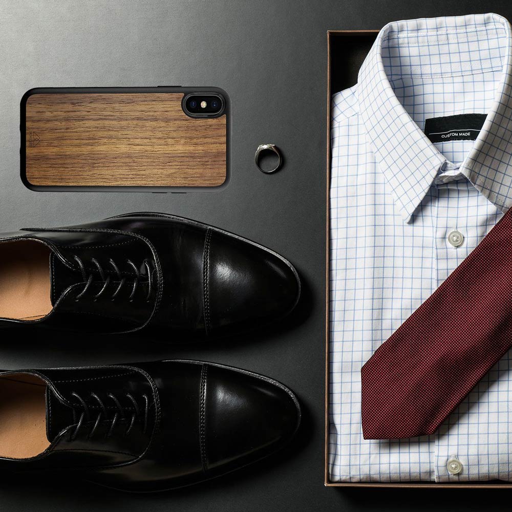 Handcrafted American Walnut phone case showcasing unique wood grain and elegant design, perfect for modern smartphones.