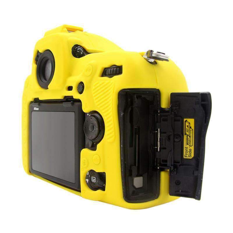 AMZER Soft Silicone Protective Case for Nikon D850 in yellow, showcasing its snug fit and precise cutouts for camera functions.