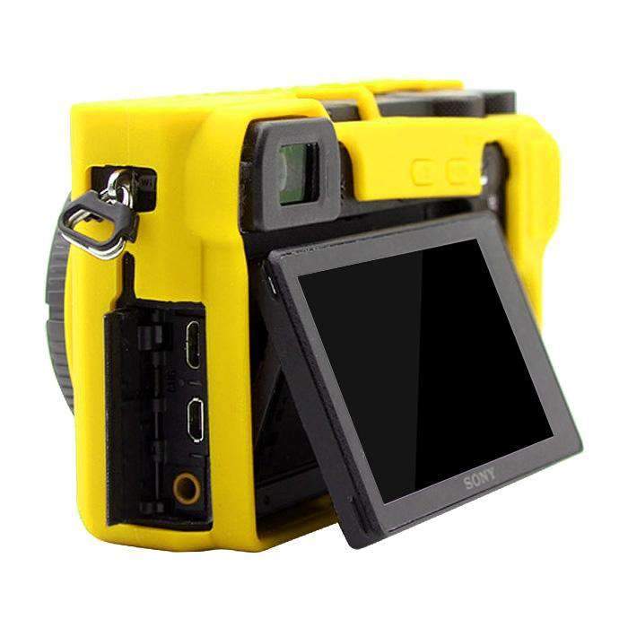 AMZER Soft Silicone Protective Case for Sony ILCE-6500 in yellow, showcasing its soft texture and precise cutouts for camera functionality.