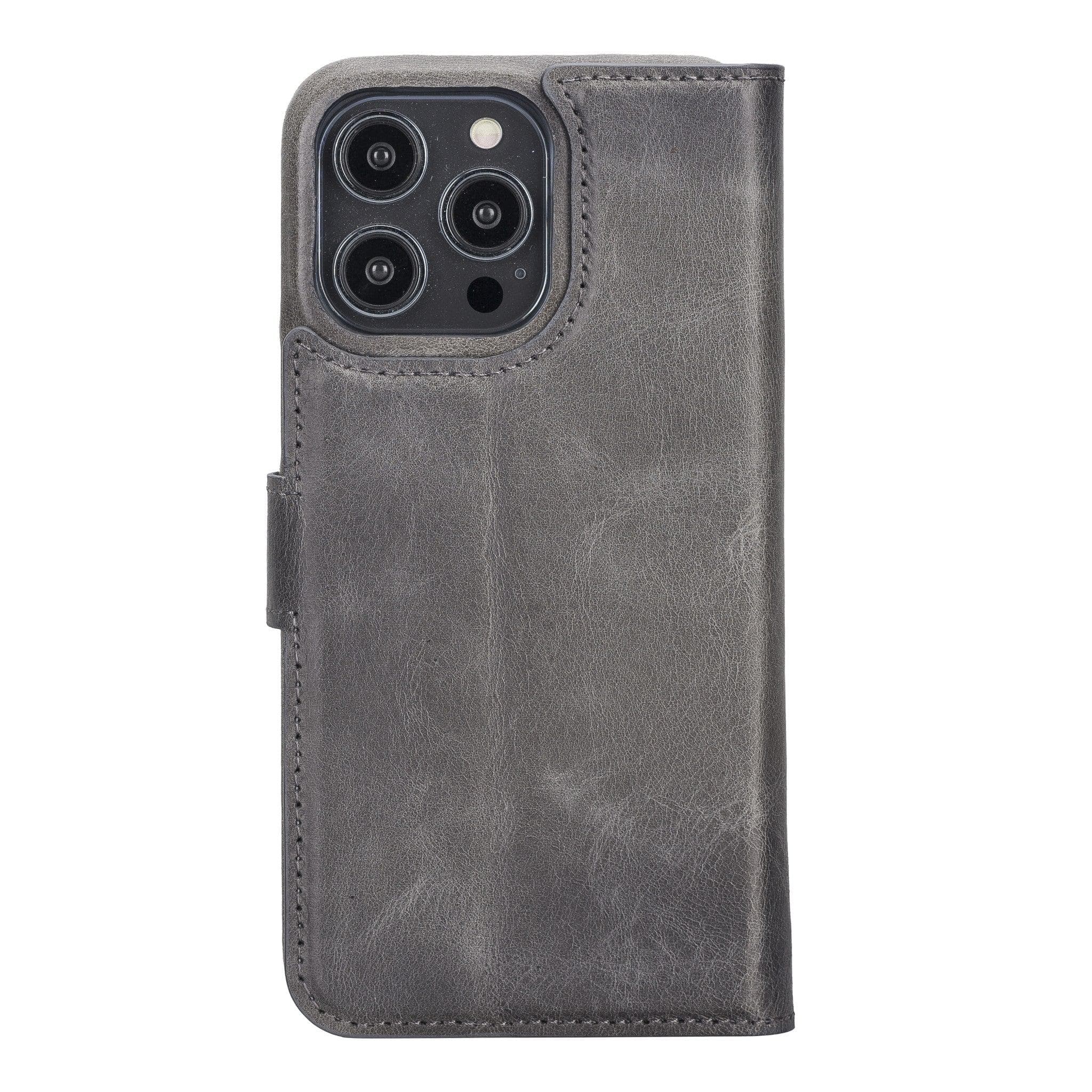 Apple iPhone 14 Series Full Leather Coating Detachable Wallet Case in black leather, showcasing its sleek design and card slots.