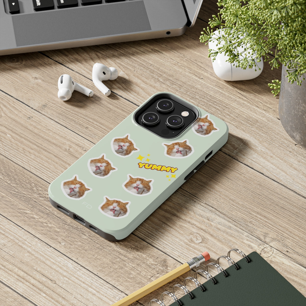 Cat Yummy Tough Case for iPhone, featuring a glossy finish and rubber lining for protection, designed for wireless charging.