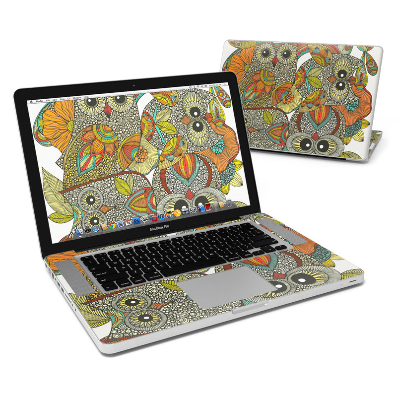 Laptop with colorful owl illustration.
