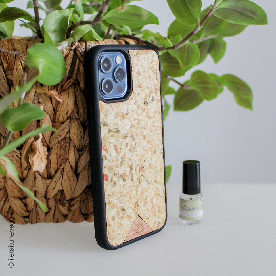 Organic Jasmine Phone Case held by a woman, showcasing its unique design and natural materials.