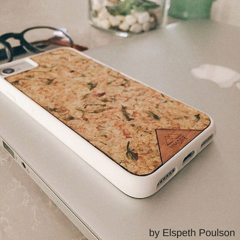 Organic Jasmine Phone Case held by a woman, showcasing its unique design and natural materials.