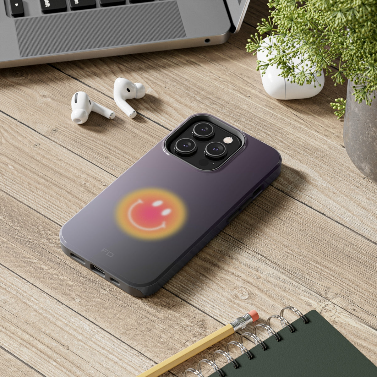 Smiley Face Tough Case for iPhone, showcasing a cheerful design with impact-resistant features and wireless charging support.