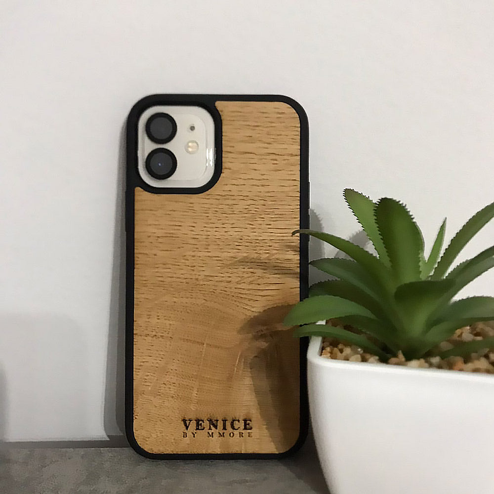 Handcrafted Venice case made from ancient oak wood with minimalist lettering design, showcasing its unique texture and craftsmanship.