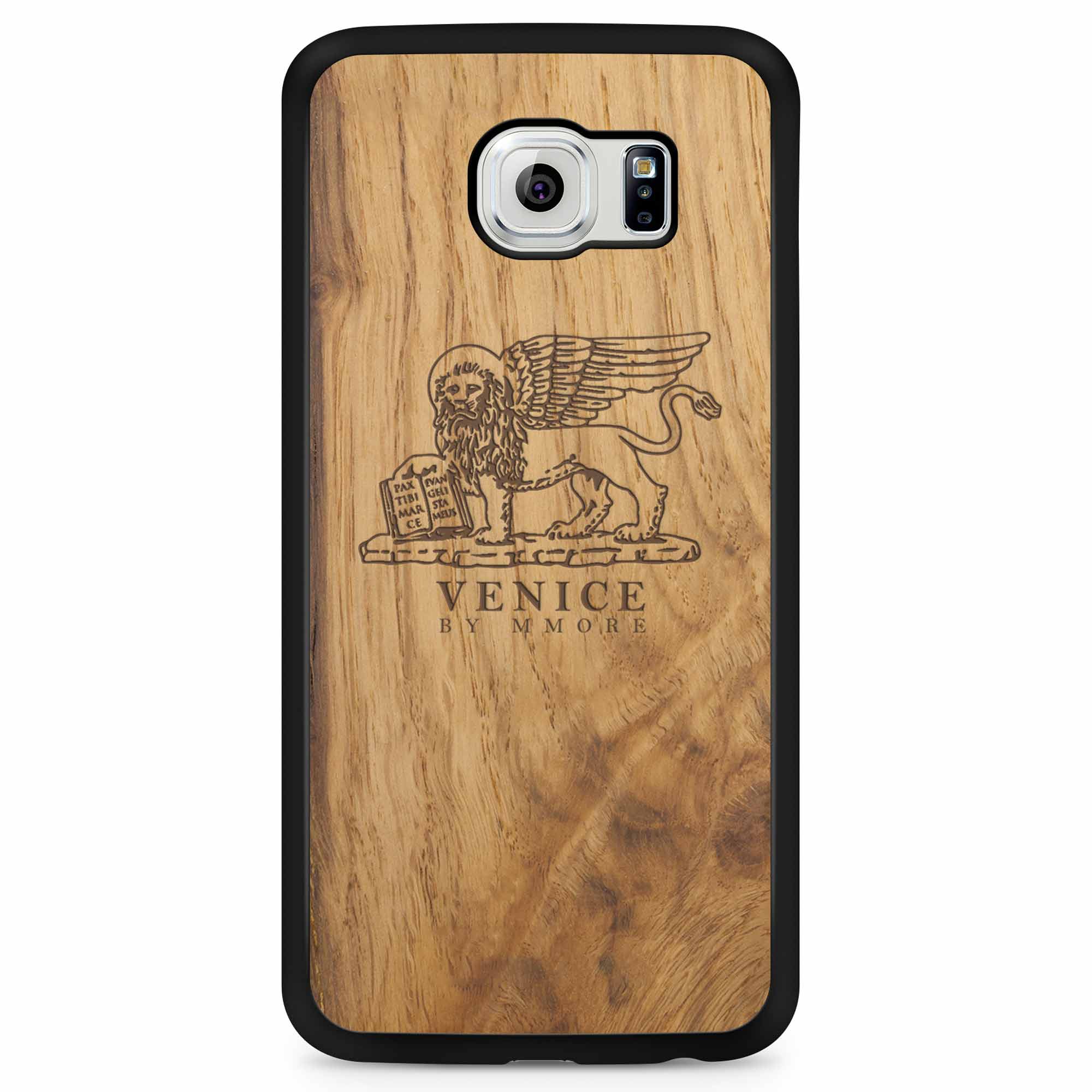 Handcrafted Venice phone case featuring the Lion of St. Marco, made from ancient oak wood, showcasing its unique grain and engraving.
